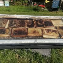Solar wax melter loaded with frames ready for wax rendering