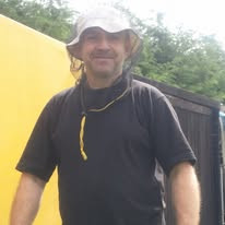 Often I work with the bees wearing just a simple face veil